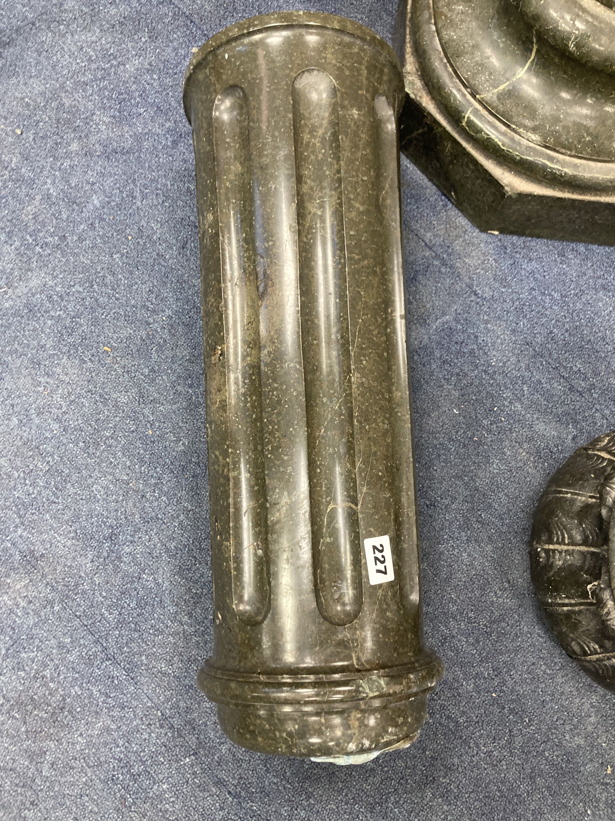 A fluted marble column (a
